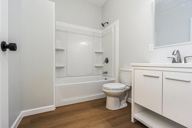408 W Exchange St, Gobles, MI 49055 - full bath with toilet, wood finished floors, vanity, bathing tub / shower combination, and baseboards