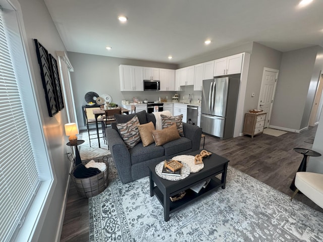 887 Rex St, Fremont, MI 49412 - living room with wood finished floors, baseboards, and recessed lighting