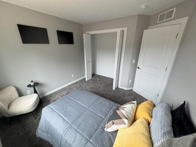 887 Rex St, Fremont, MI 49412 - bedroom featuring dark carpet and baseboards