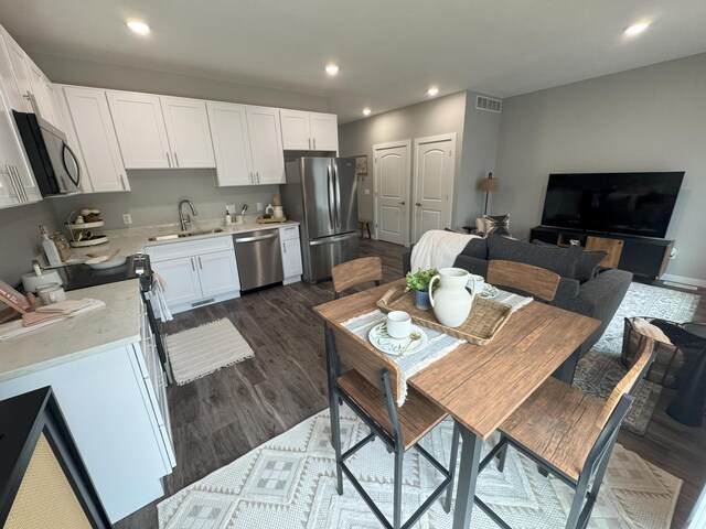 887 Rex St, Fremont, MI 49412 - dining area featuring recessed lighting and dark wood-style floors