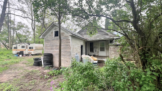 8059 N Wheeler Rd, Wheeler, MI 48662 - rear view of property with stone siding