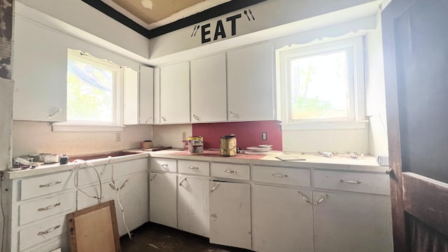8059 N Wheeler Rd, Wheeler, MI 48662 - kitchen with white cabinetry and light countertops