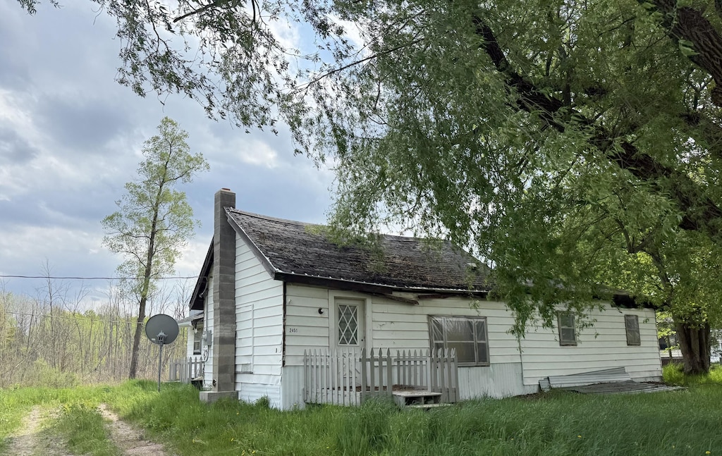 2451 US Highway 10, Sears, MI 49679 - view of front facade with a chimney