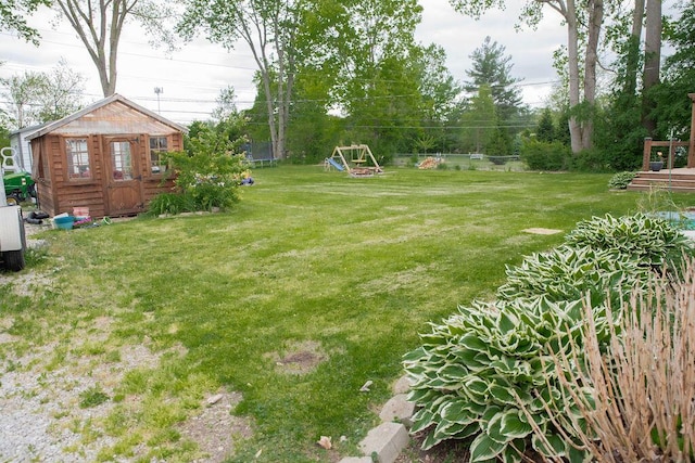 19610 Brentwood St, Livonia, MI 48152 - view of grassy yard featuring an outbuilding and a trampoline