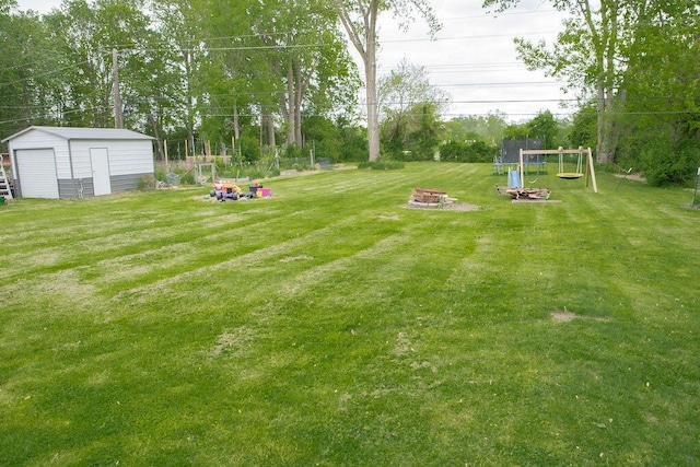 19610 Brentwood St, Livonia, MI 48152 - view of green lawn featuring an outdoor structure, a fire pit, and a storage unit