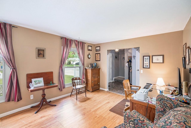 office space featuring light wood-style floors and baseboards