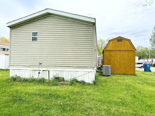 1950 S 13th St Lot 229, Niles, MI 49120 - view of property exterior with cooling unit and a lawn