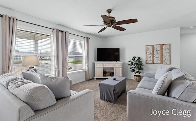 4755 Boulder Dr, Holland, MI 49423 - living area featuring light carpet, a ceiling fan, and baseboards
