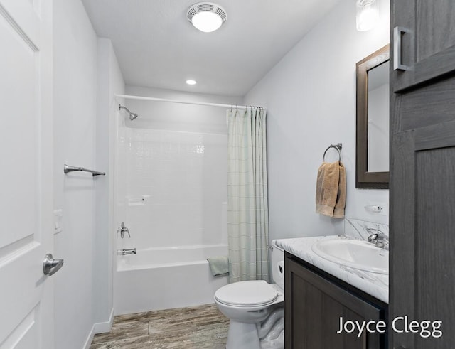 4755 Boulder Dr, Holland, MI 49423 - bathroom featuring vanity, toilet, shower / bath combo with shower curtain, and wood finished floors