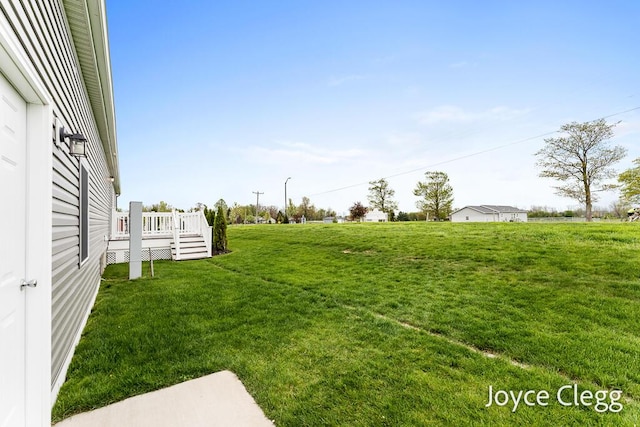 4755 Boulder Dr, Holland, MI 49423 - view of grassy yard featuring a wooden deck