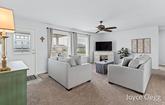 4755 Boulder Dr, Holland, MI 49423 - living area featuring a ceiling fan, light carpet, and baseboards
