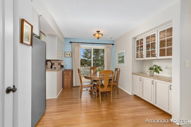 dining room with light wood-style floors