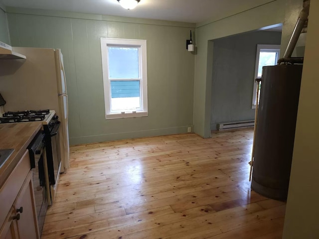 kitchen featuring baseboard heating, light wood-style floors, gas stove, refrigerator, and water heater