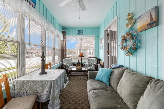 705.5 E Ludington Ave, Ludington, MI 49431 - sunroom with ceiling fan, an outdoor hangout area, and carpet flooring