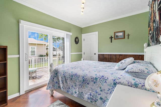 705.5 E Ludington Ave, Ludington, MI 49431 - bedroom with access to outside and crown molding
