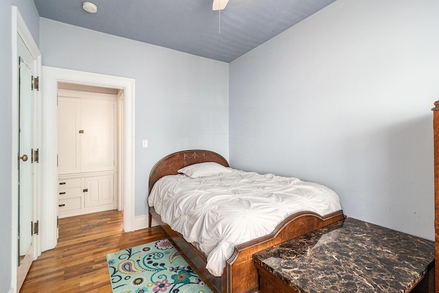 705.5 E Ludington Ave, Ludington, MI 49431 - bedroom featuring wood finished floors, a ceiling fan, and lofted ceiling