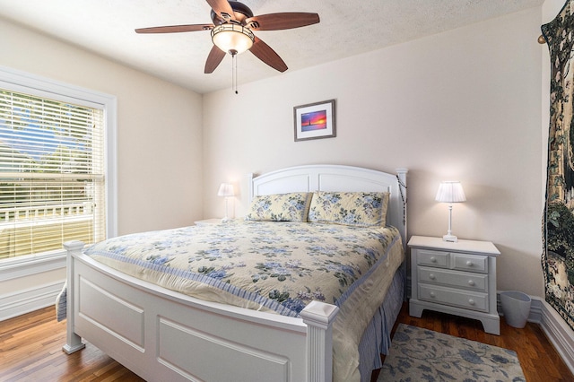 705.5 E Ludington Ave, Ludington, MI 49431 - bedroom featuring wood finished floors, baseboards, and ceiling fan