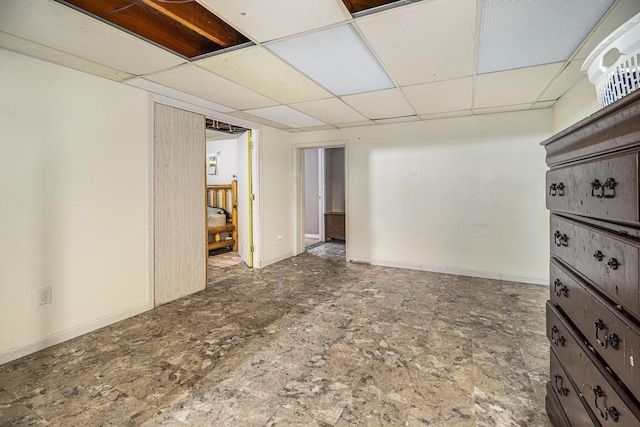 empty room with a paneled ceiling