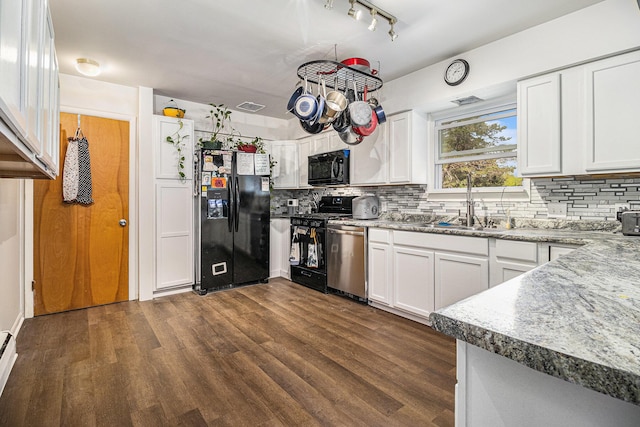 kitchen with black appliances, backsplash, dark wood-type flooring, and white cabinetry