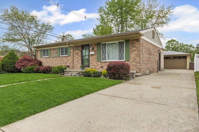 ranch-style house with brick siding, an outbuilding, a front lawn, and a garage