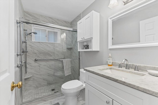 full bath featuring marble finish flooring, toilet, a stall shower, and vanity