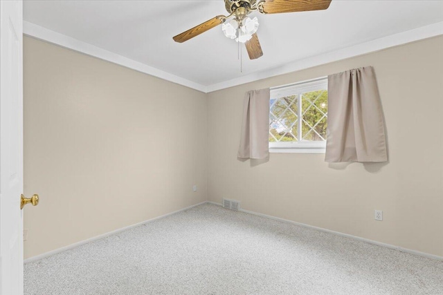unfurnished room featuring carpet floors, baseboards, and ceiling fan