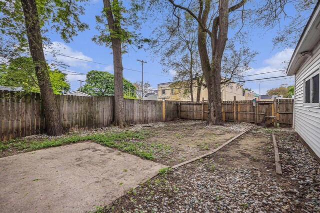 2145 Horton Ave SE, Grand Rapids, MI 49507 - fenced backyard featuring a patio area