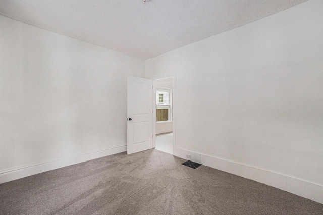 2145 Horton Ave SE, Grand Rapids, MI 49507 - spare room with carpet flooring and baseboards