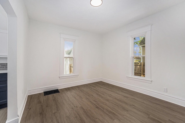 2145 Horton Ave SE, Grand Rapids, MI 49507 - empty room with dark wood-style floors and baseboards