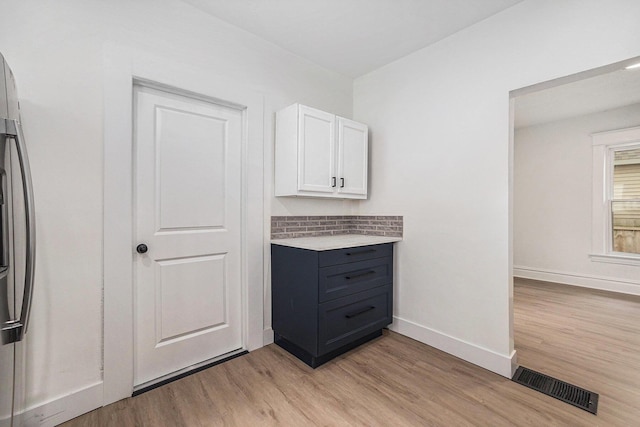 2145 Horton Ave SE, Grand Rapids, MI 49507 - interior space with light wood finished floors, baseboards, and tasteful backsplash