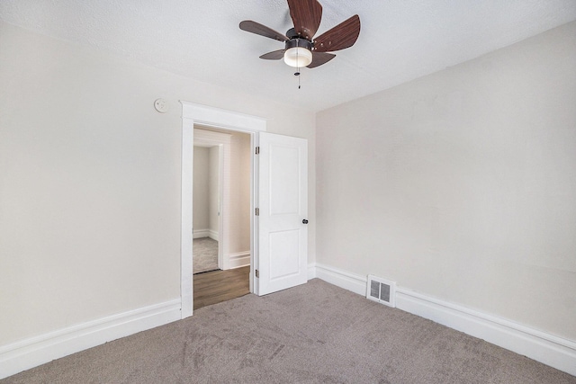 2145 Horton Ave SE, Grand Rapids, MI 49507 - spare room featuring carpet floors, ceiling fan, a smoke detector, and baseboards