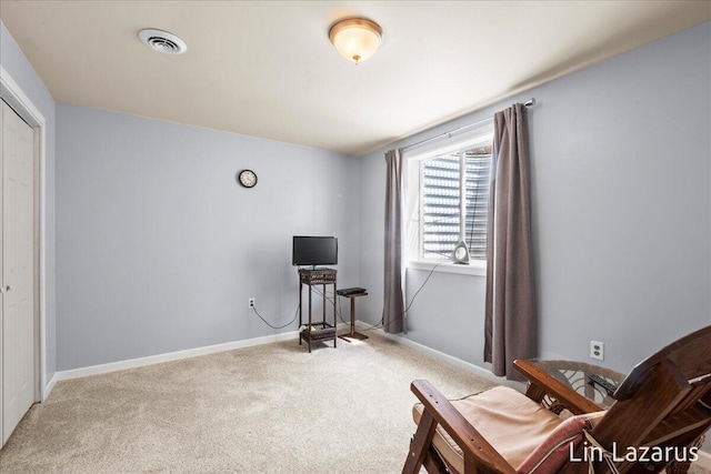 living area with carpet flooring and baseboards