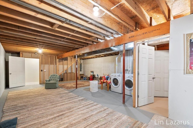 unfinished basement featuring independent washer and dryer