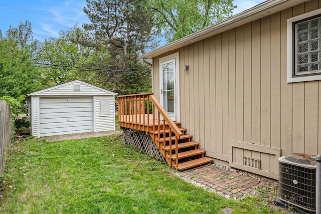 223 N Edison, Royal Oak, MI 48067 - view of grassy yard with central AC unit, an outbuilding, and a deck