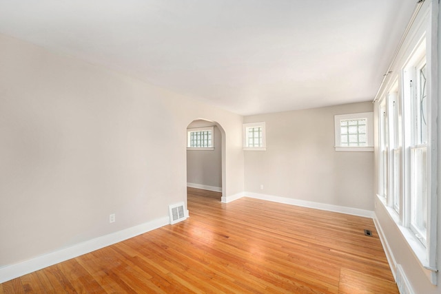 223 N Edison, Royal Oak, MI 48067 - unfurnished room with baseboards, arched walkways, and light wood-style flooring