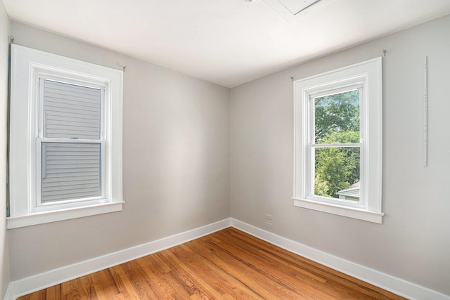 223 N Edison, Royal Oak, MI 48067 - spare room with baseboards, healthy amount of natural light, and light wood-style flooring