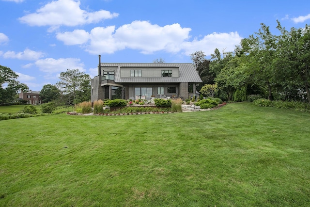 1950 Robinson Rd SE, East Grand Rapids, MI 49506 - rear view of property featuring a lawn and metal roof