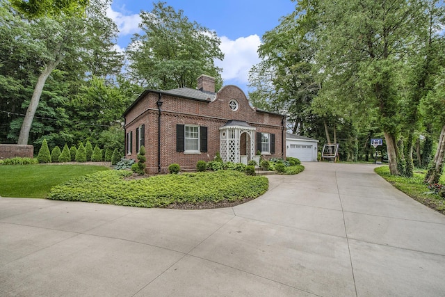 1950 Robinson Rd SE, East Grand Rapids, MI 49506 - view of front of house with brick siding and a chimney