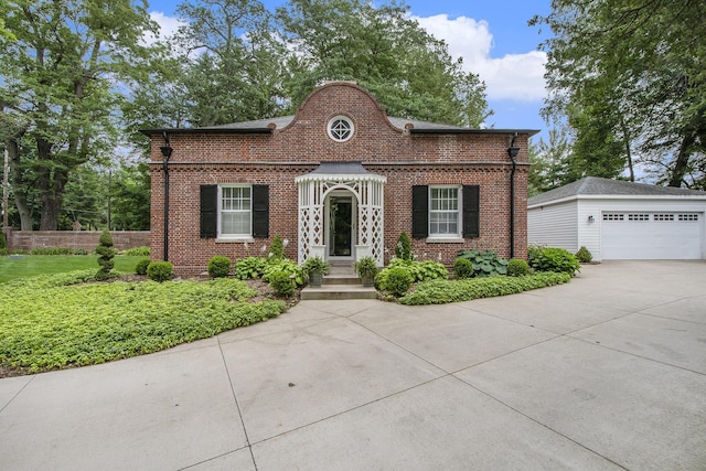 1950 Robinson Rd SE, East Grand Rapids, MI 49506 - view of front of house with brick siding and a detached garage