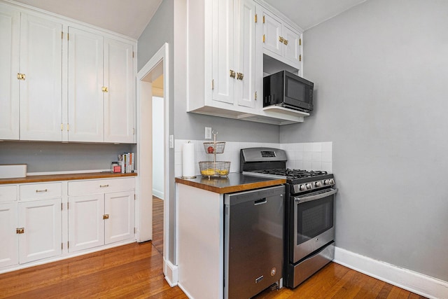 1950 Robinson Rd SE, East Grand Rapids, MI 49506 - kitchen featuring stainless steel appliances, light wood-type flooring, and white cabinets