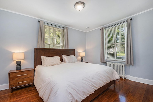 1950 Robinson Rd SE, East Grand Rapids, MI 49506 - bedroom with radiator heating unit, crown molding, baseboards, wood-type flooring, and multiple windows