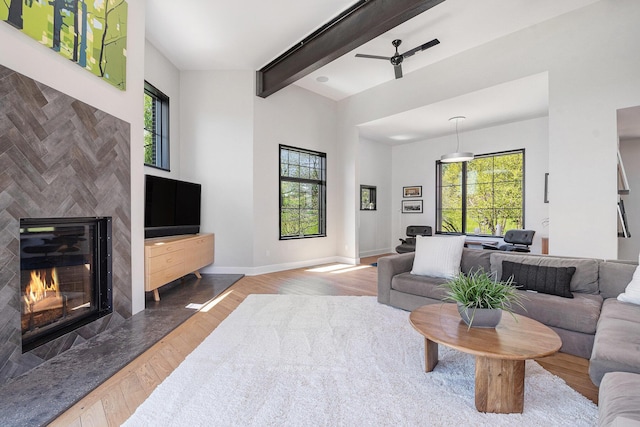1950 Robinson Rd SE, East Grand Rapids, MI 49506 - living area with wood finished floors, a fireplace, beam ceiling, and baseboards