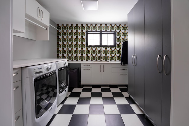 1950 Robinson Rd SE, East Grand Rapids, MI 49506 - clothes washing area with washer and dryer, dark floors, and cabinet space
