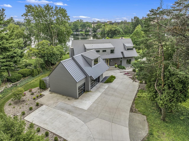 1950 Robinson Rd SE, East Grand Rapids, MI 49506 - rear view of property with a water view, a standing seam roof, and metal roof