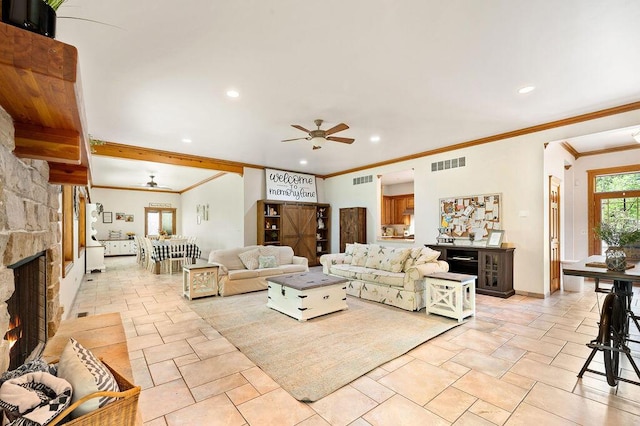 16431 Glassman Rd, Union Pier, MI 49129 - living room featuring ceiling fan, crown molding, recessed lighting, a stone fireplace, and stone tile flooring
