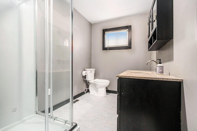 21164 Calvin Hill St, Cassopolis, MI 49031 - bathroom featuring a stall shower, baseboards, toilet, and vanity