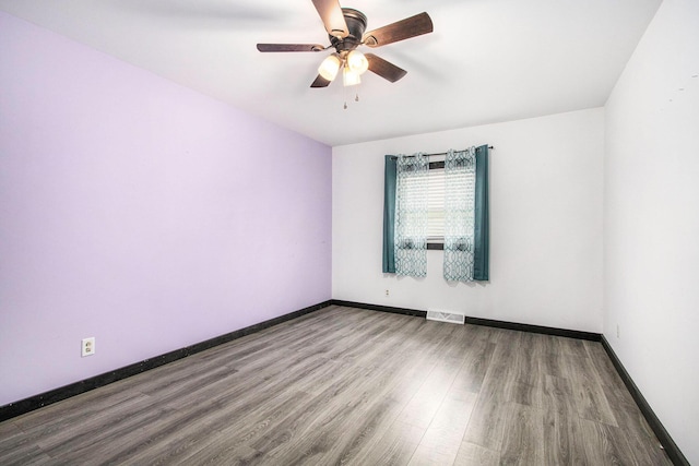 21164 Calvin Hill St, Cassopolis, MI 49031 - empty room featuring wood finished floors, baseboards, and a ceiling fan