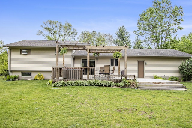 rear view of property with a pergola, a wooden deck, and a yard