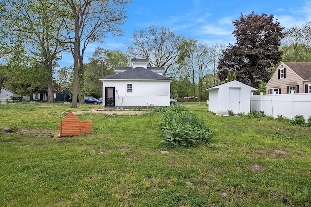 2228 Regent St, Kalamazoo, MI 49004 - view of yard featuring a storage unit and an outbuilding