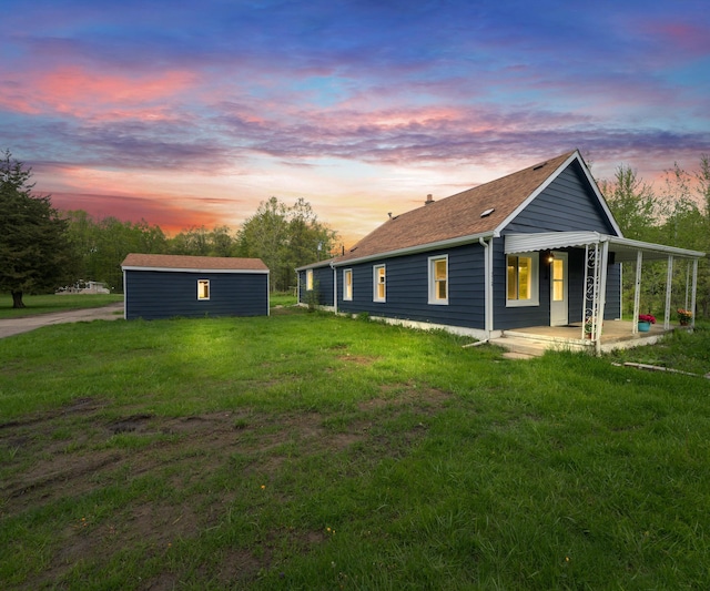 24108 Martinsville Rd, Belleville, MI 48111 - property exterior at dusk featuring a lawn and a porch